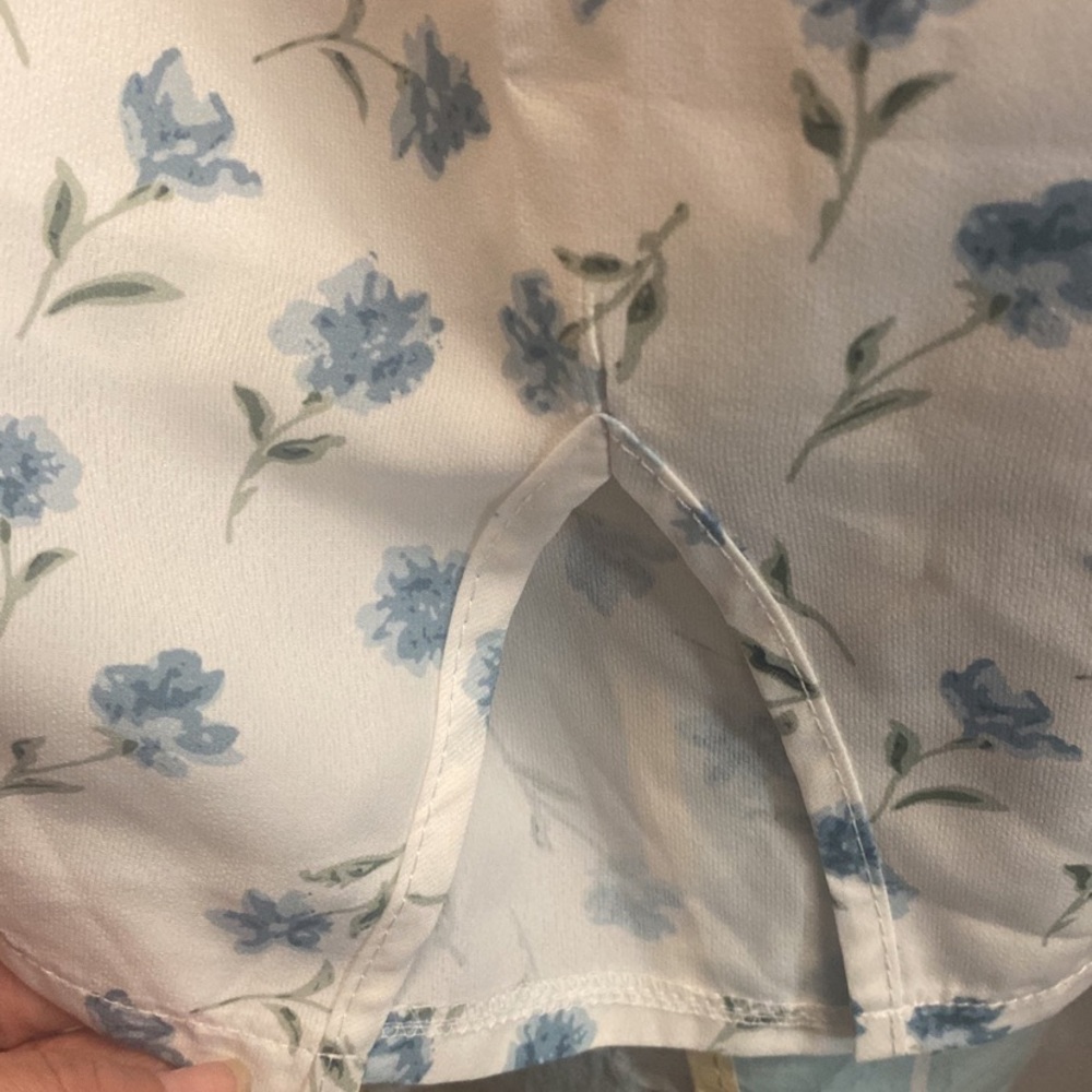 White skirt with blue flowers